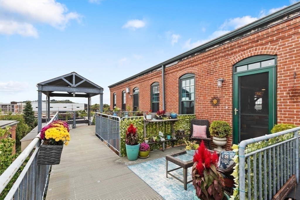60 Dudley Street, Unit 32 Chelsea, MA 02150 - Photo 1 of 38 a front view of a house with sitting area