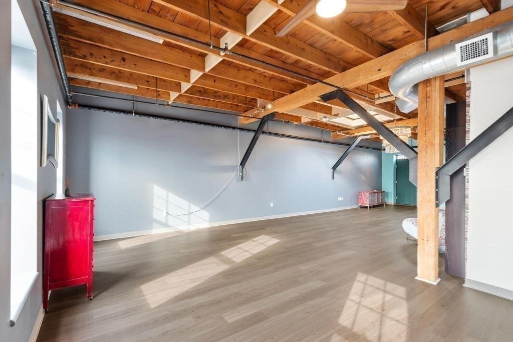 60 Dudley Street, Unit 32 Chelsea, MA 02150 - Photo 19 of 38 a view of a room with wooden walls and stairs