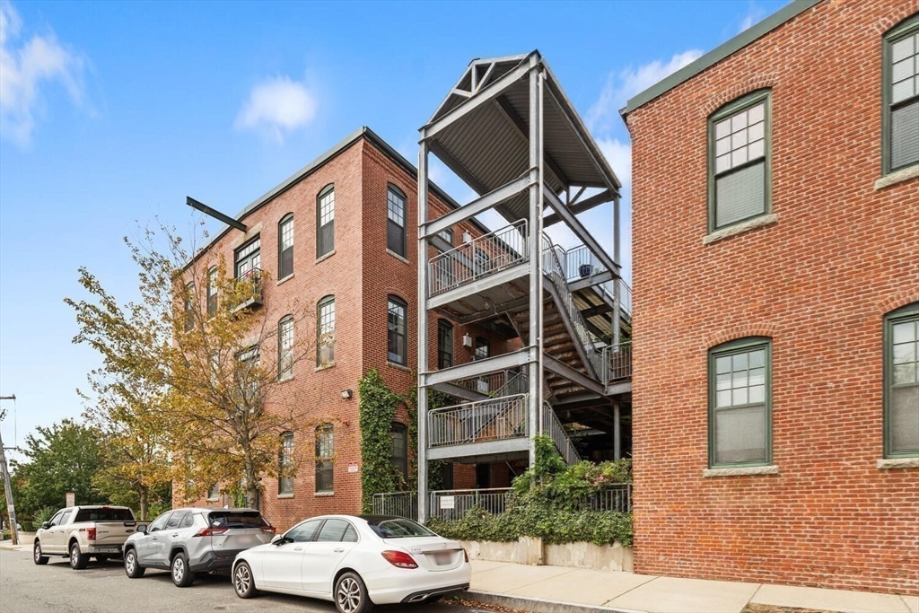 60 Dudley Street, Unit 32 Chelsea, MA 02150 - Photo 23 of 38 a view of a car park in front of a building