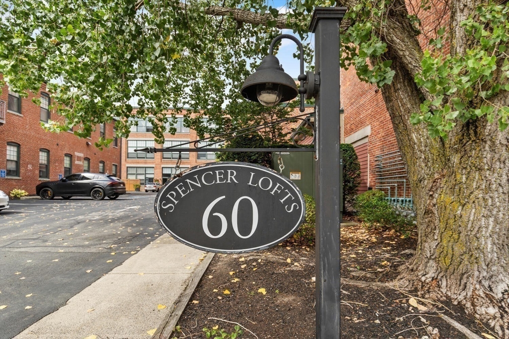60 Dudley Street, Unit 32 Chelsea, MA 02150 - Photo 27 of 38 a view of a street sign with large trees