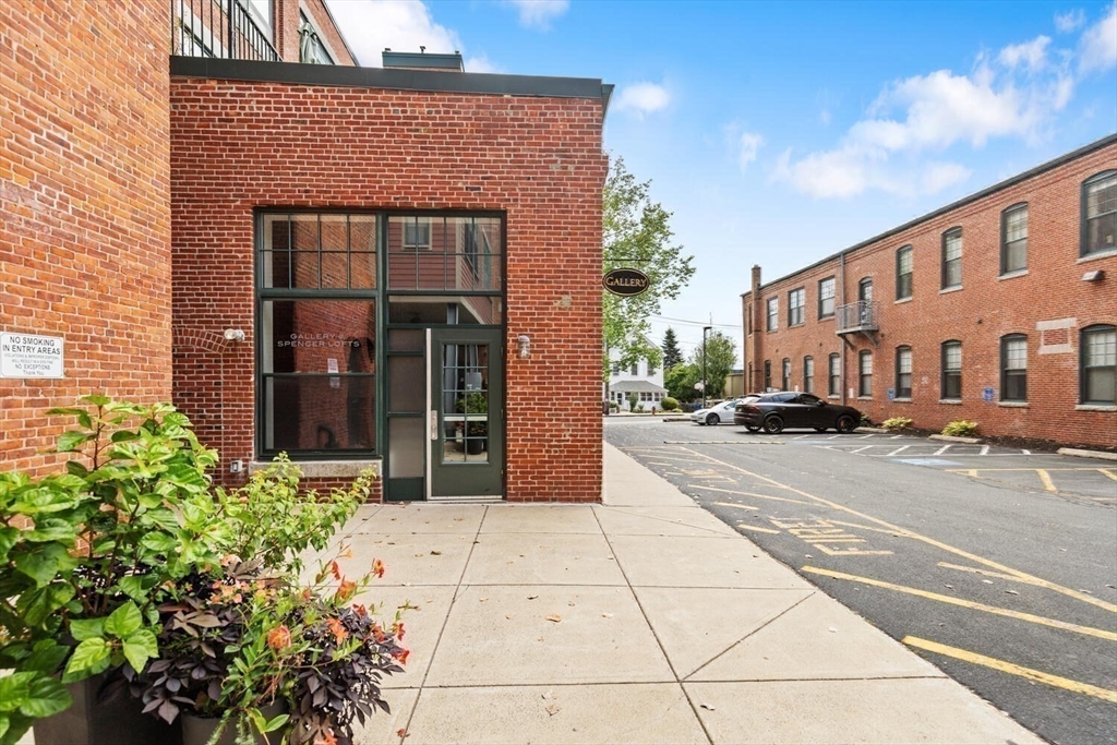 60 Dudley Street, Unit 32 Chelsea, MA 02150 - Photo 28 of 38 a view of a brick building with many windows