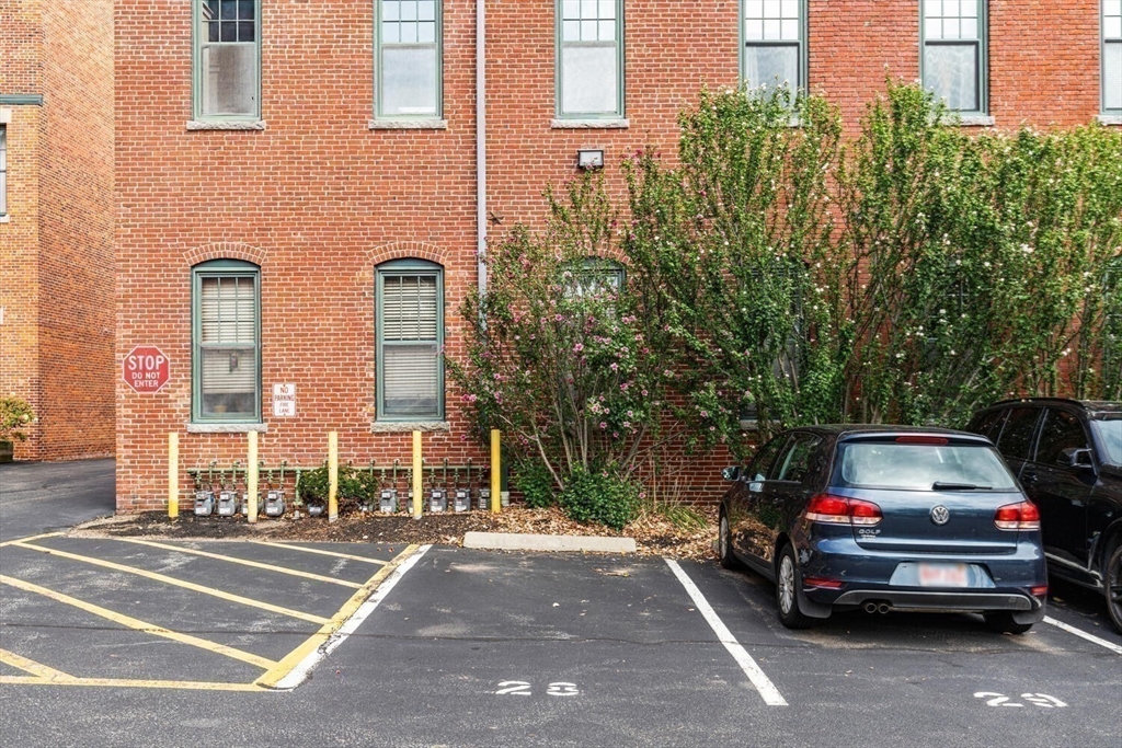 60 Dudley Street, Unit 32 Chelsea, MA 02150 - Photo 38 of 38 a view of a car parked in front of a brick house
