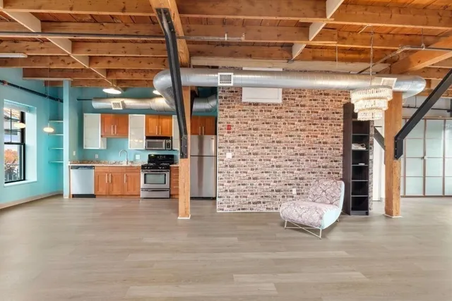a view of a patio with table and chairs and potted plants