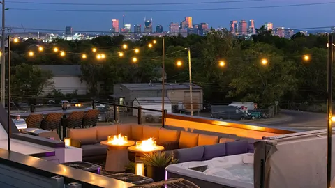 a view of a swimming pool with outdoor seating