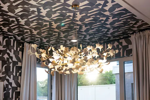 a bedroom with bed and a chandelier