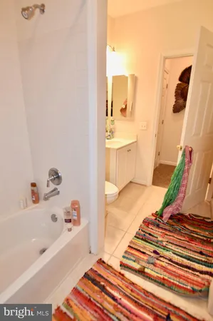 a bathroom with a bathtub and a sink