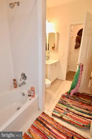 a bathroom with a bathtub and a sink