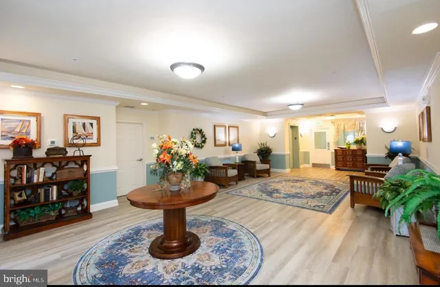 a living room with furniture a dining table and chairs