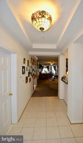 a view of entryway with a chandelier
