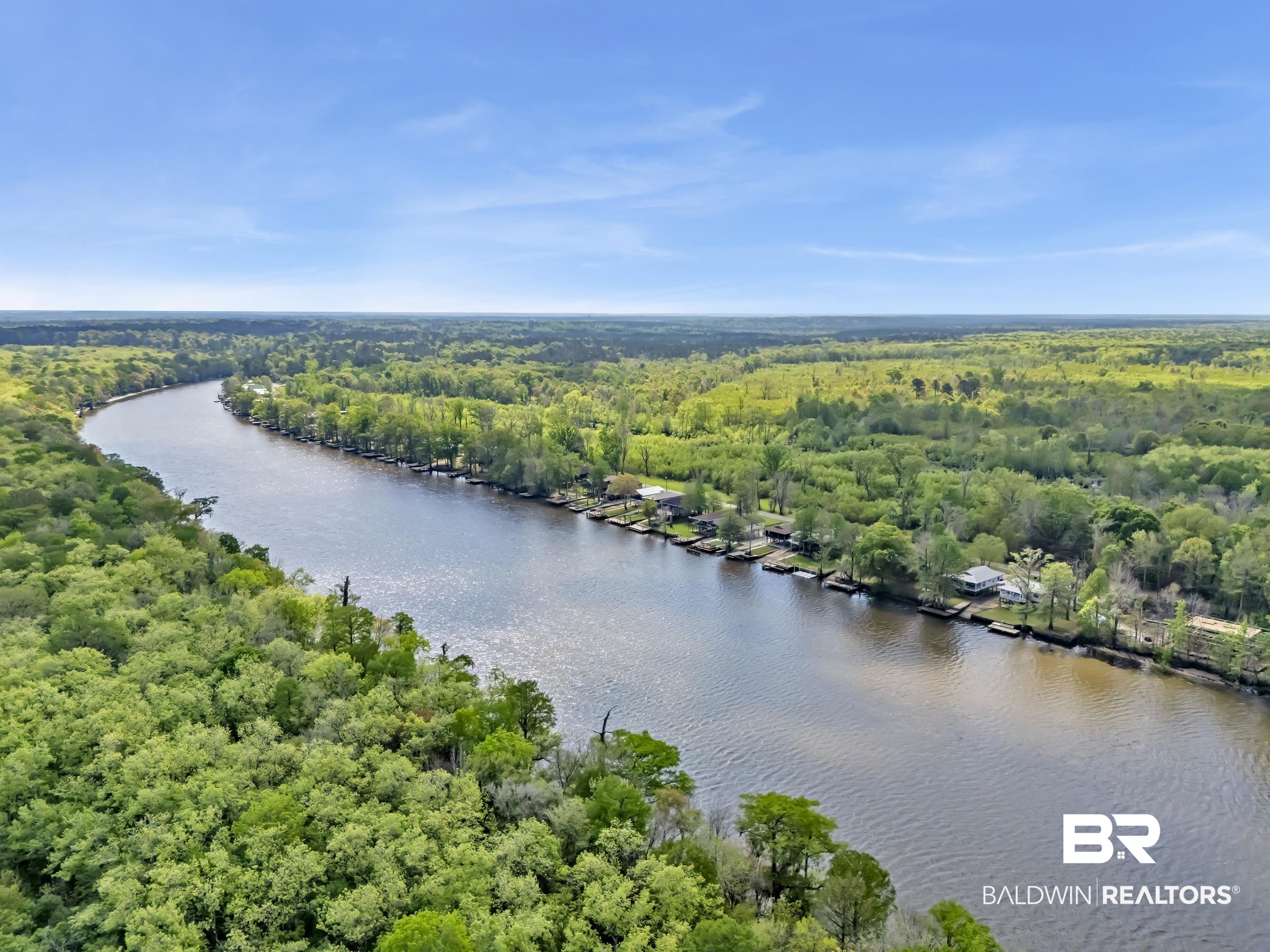 8081 Bryant's Lndg Road Stockton, AL 36579 - Photo 43 of 48 Drone / aerial view of a forest and a large body of water