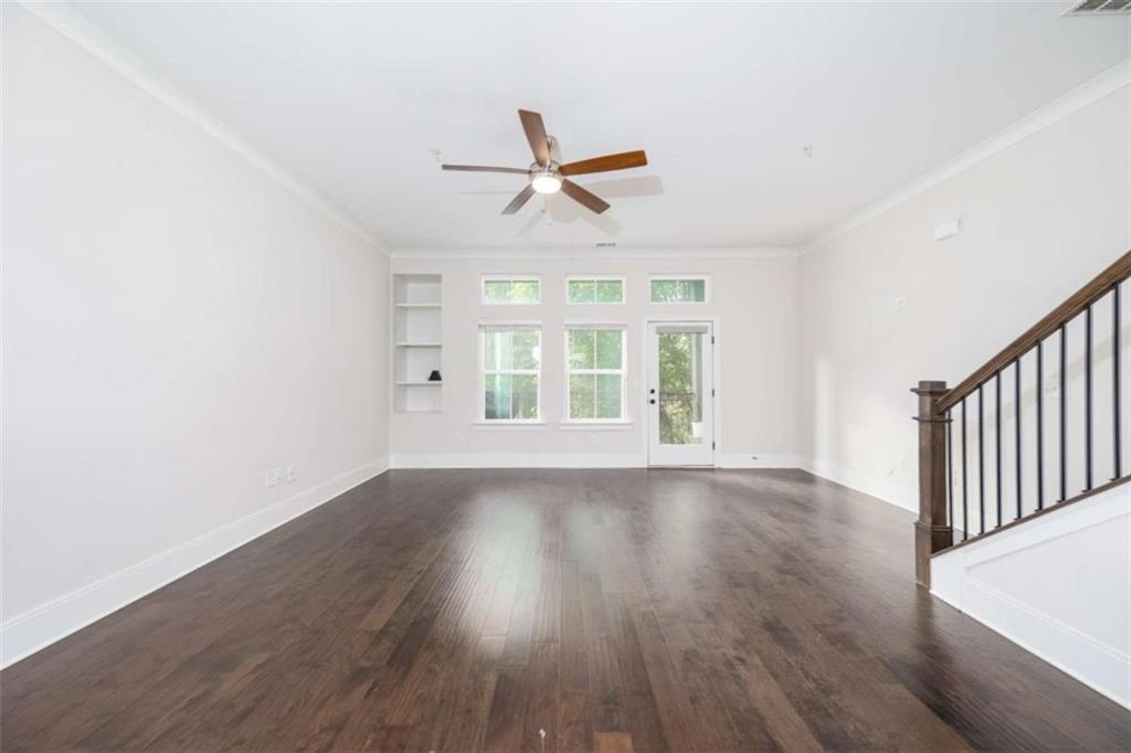 915 Katie Kerr Drive Decatur, GA 30030 - Photo 11 of 30 wooden floor in an empty room with a window