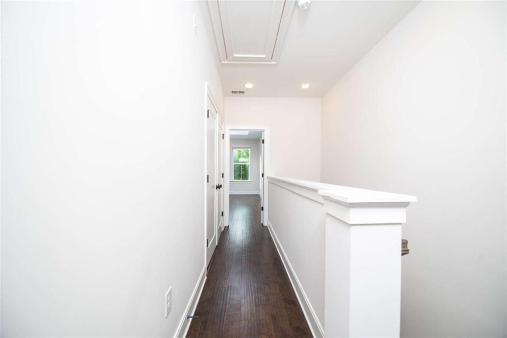 915 Katie Kerr Drive Decatur, GA 30030 - Photo 15 of 30 a view of a hallway with wooden floor