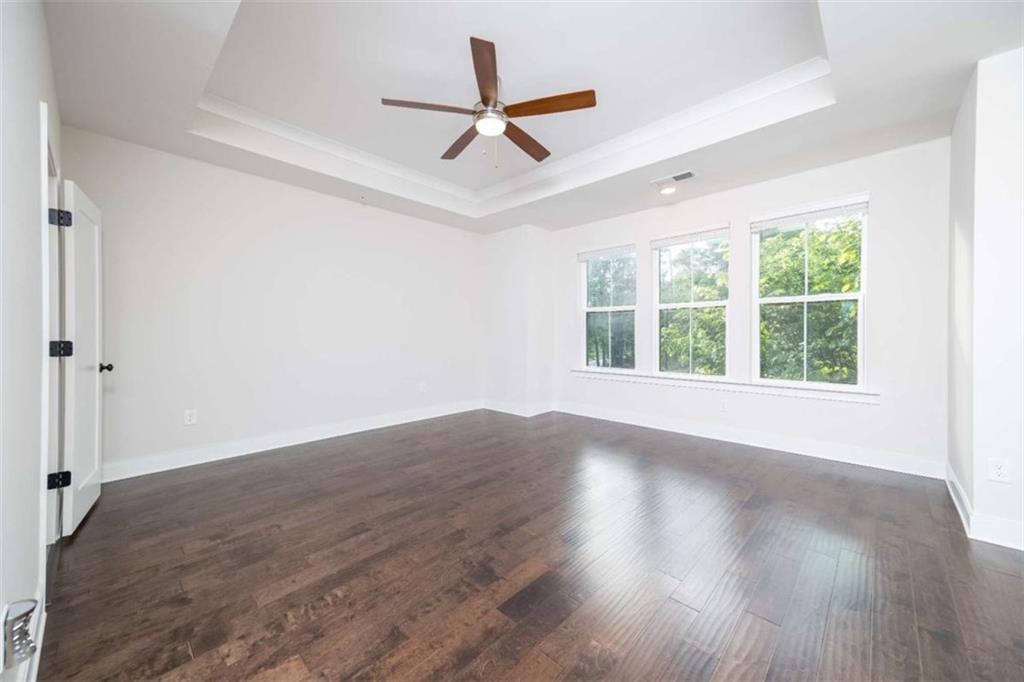 915 Katie Kerr Drive Decatur, GA 30030 - Photo 16 of 30 wooden floor in an empty room with a window