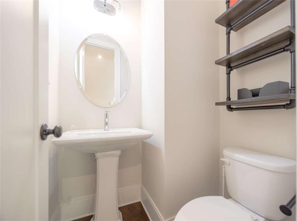 915 Katie Kerr Drive Decatur, GA 30030 - Photo 22 of 30 a bathroom with a toilet a sink and mirror