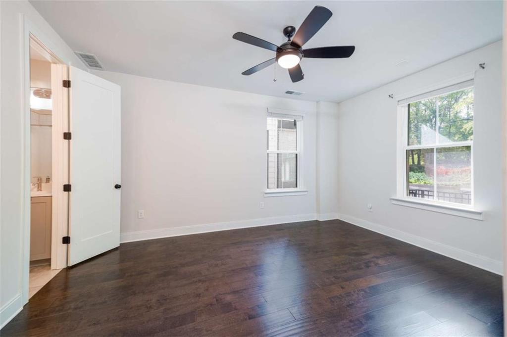 915 Katie Kerr Drive Decatur, GA 30030 - Photo 25 of 30 wooden floor in an empty room with a window