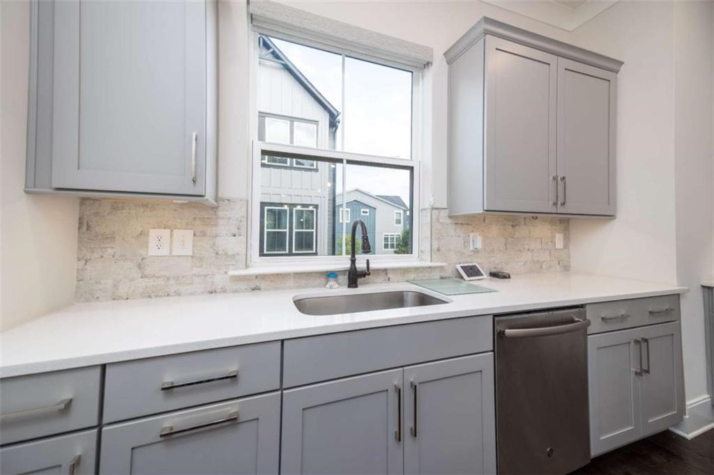 915 Katie Kerr Drive Decatur, GA 30030 - Photo 8 of 30 a kitchen with a sink and cabinets