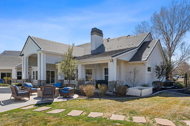 2917 Old Farm Road Washington, UT 84780 - Photo 45 of 105 Back of house featuring a patio area, a yard, an outdoor hangout area, and a chimney