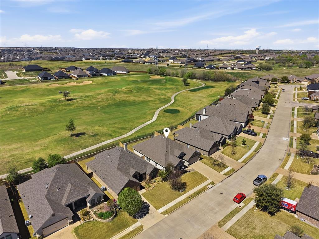 7224 Prestwick Terrace Benbrook, TX 76126 - Photo 25 of 26 Perfectly positioned within a quiet, established neighborhood, this property boasts exceptional curb appeal and a backyard that opens directly onto the manicured fairways. Enjoy the luxury of space and the beauty of nature right outside your door