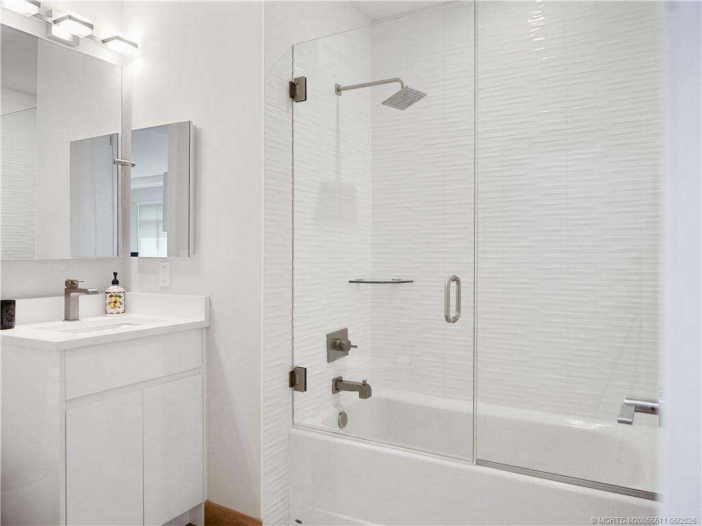 41 Southwest Seminole Street, Unit 208 Stuart, FL 34994 - Photo 33 of 46 a bathroom with a bathtub and a sink