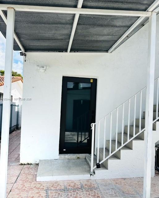 11870 Southwest 5th Street, Unit A Miami, FL 33184 - Photo 1 of 18 a view of a entrance to house