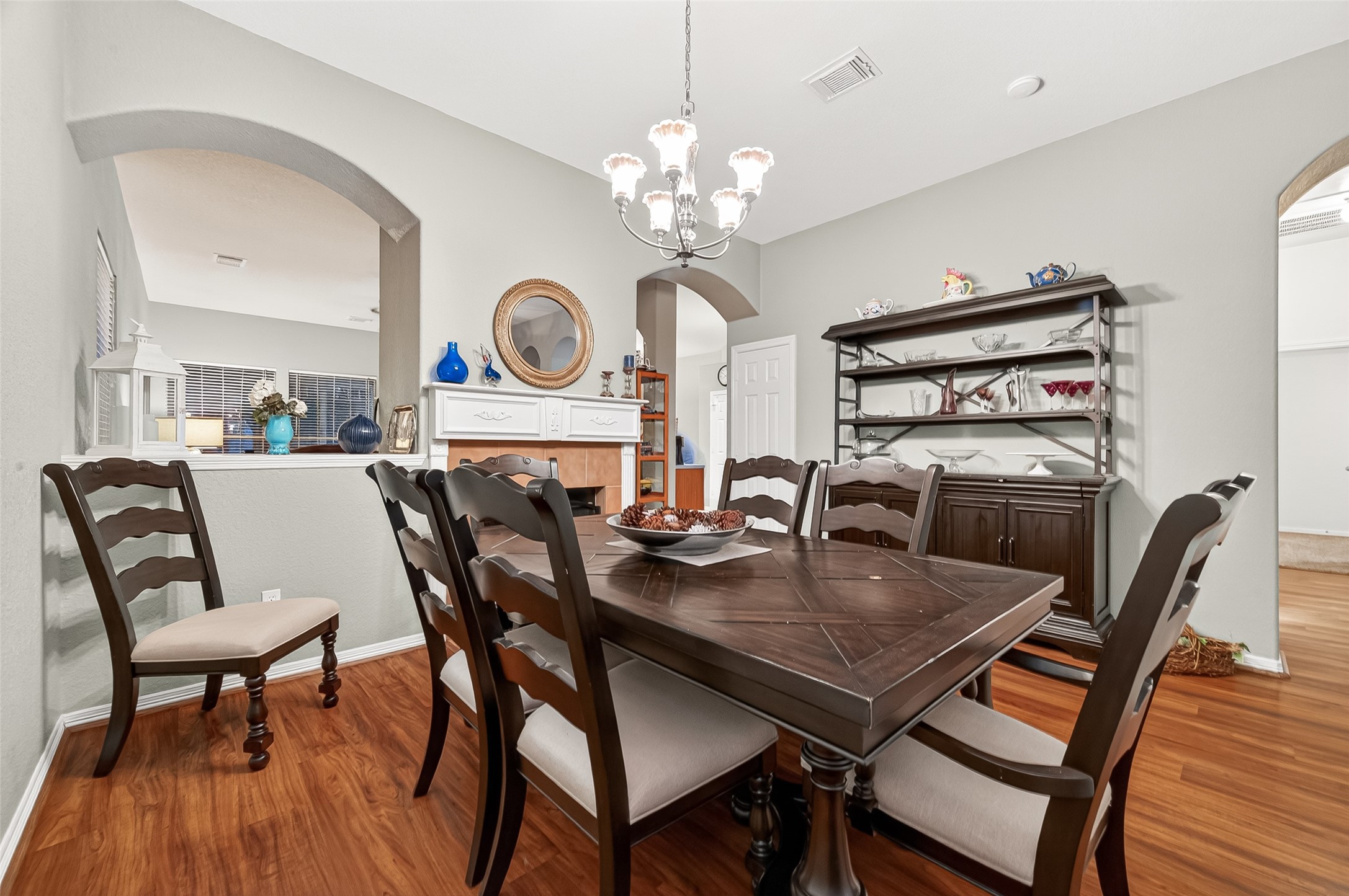 12455 West Summerlin Conroe, TX 77302 - Photo 7 of 31 a view of a dining room with furniture and wooden floor