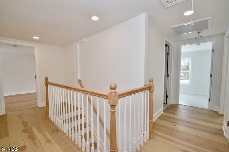 5612 Berkshire Valley Road Oak Ridge, NJ 07438 - Photo 11 of 19 a view of a hallway with wooden floor