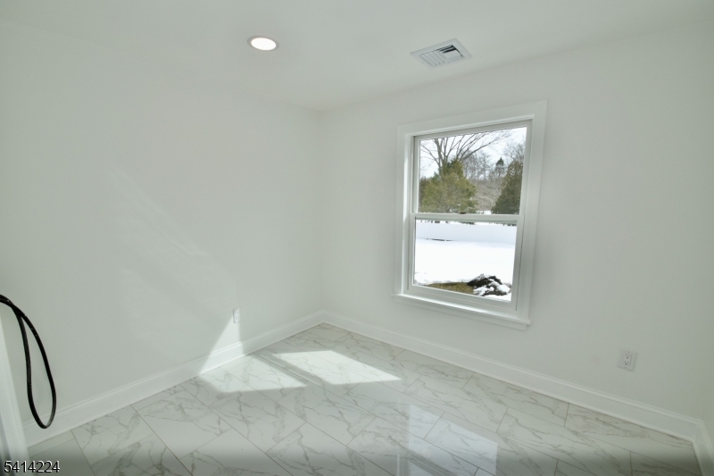 5612 Berkshire Valley Road Oak Ridge, NJ 07438 - Photo 16 of 19 an empty room with a window