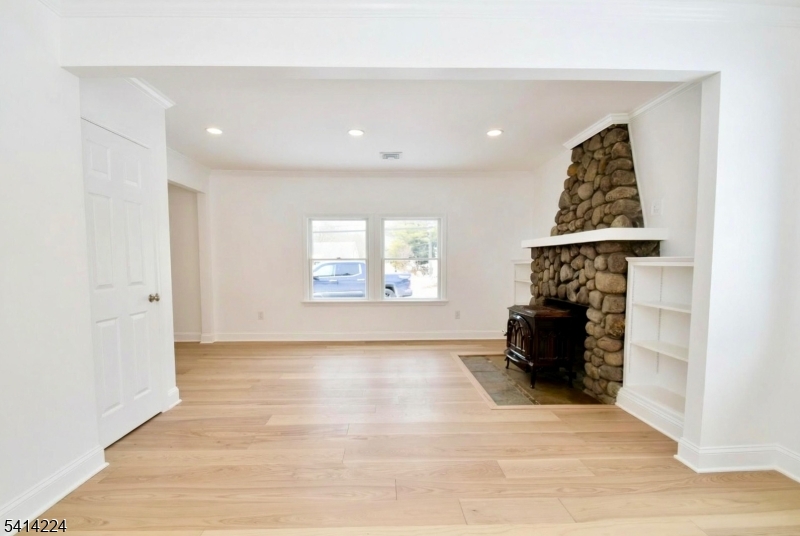 5612 Berkshire Valley Road Oak Ridge, NJ 07438 - Photo 5 of 19 a view of livingroom with furniture wooden floor and window