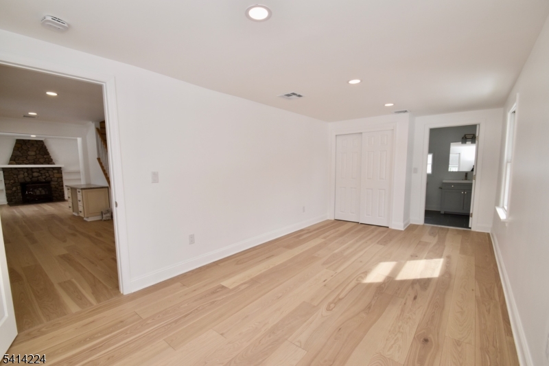 5612 Berkshire Valley Road Oak Ridge, NJ 07438 - Photo 9 of 19 a view of empty room with wooden floor
