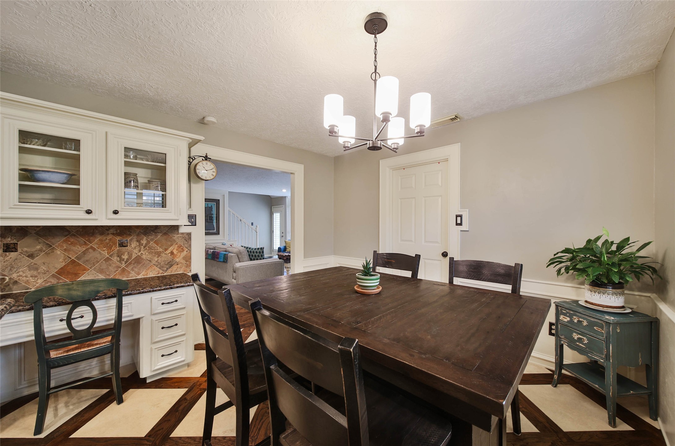 17007 Windrow Drive Spring, TX 77379 - Photo 12 of 46 a view of a dining room with furniture a chandelier and wooden floor