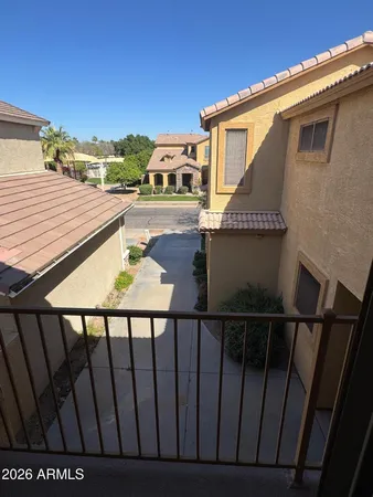 a view of a house with backyard and deck