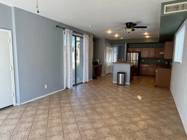 a view of a livingroom with furniture and a ceiling fan