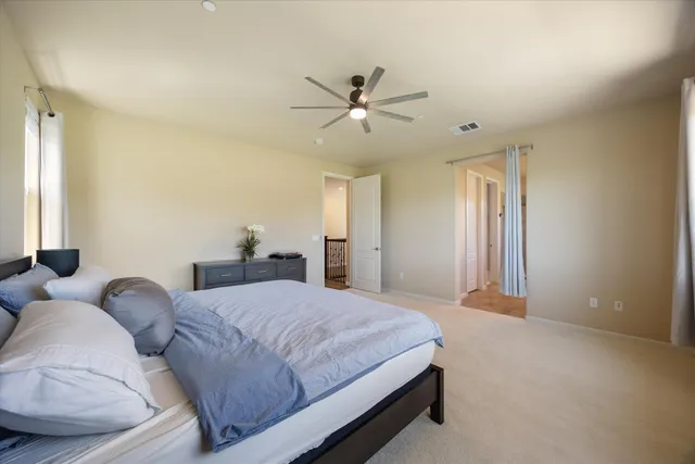 a bedroom with a bed and window