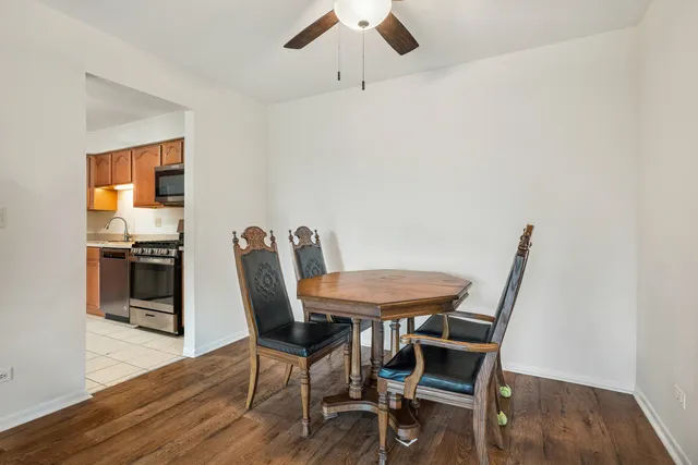 a view of a dining room with furniture and wooden floor