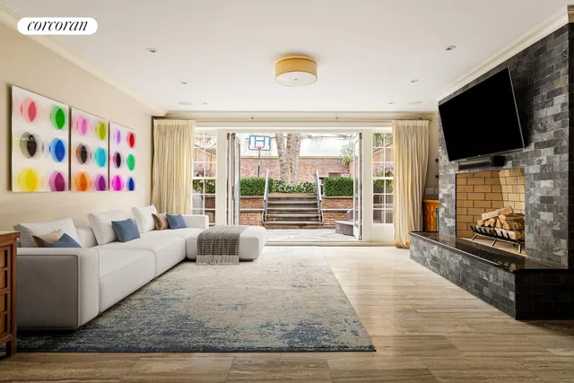 a living room with furniture fireplace and flat screen tv