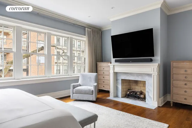 a bathroom with a bathtub sink mirror and toilet