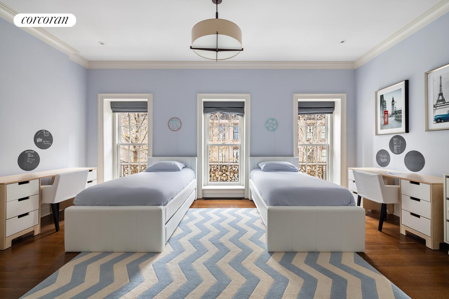 435 East 87th Street Manhattan, NY 10128 - Photo 24 of 36 a living room with furniture and a window