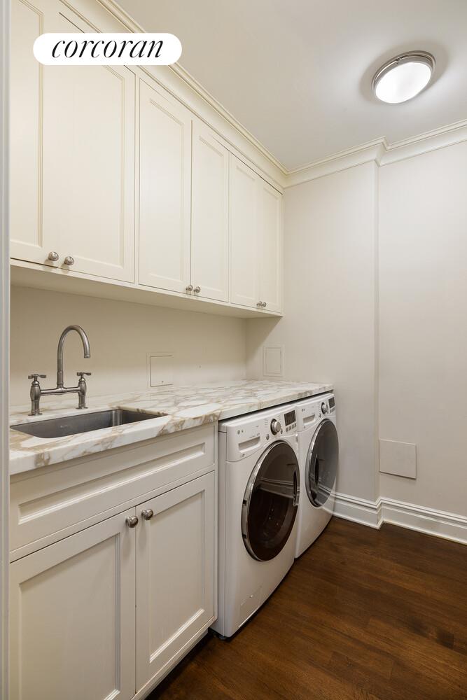 435 East 87th Street Manhattan, NY 10128 - Photo 27 of 36 a utility room with sink dryer and washer