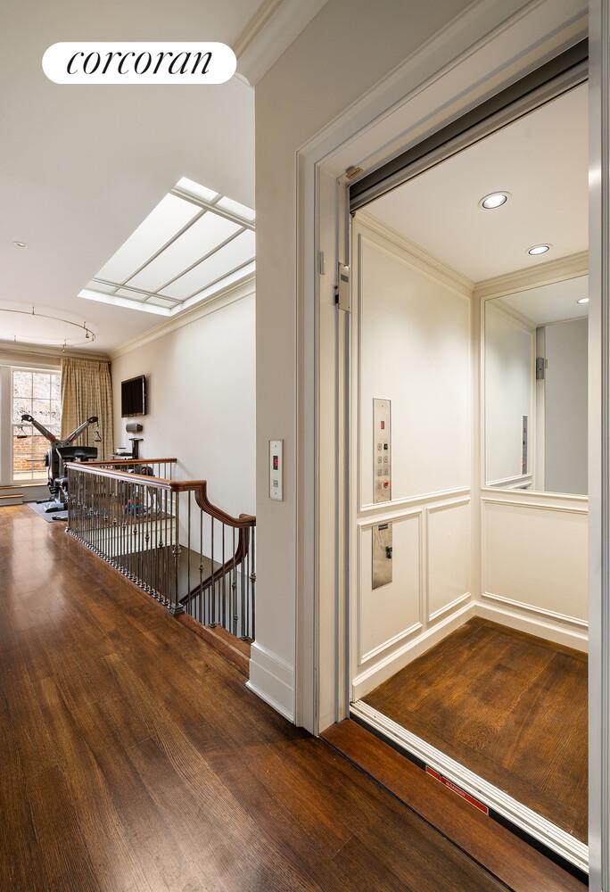 435 East 87th Street Manhattan, NY 10128 - Photo 30 of 36 a view of a livingroom with furniture and hardwood floor