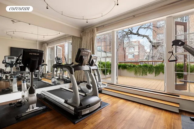 a view of a balcony with potted plants