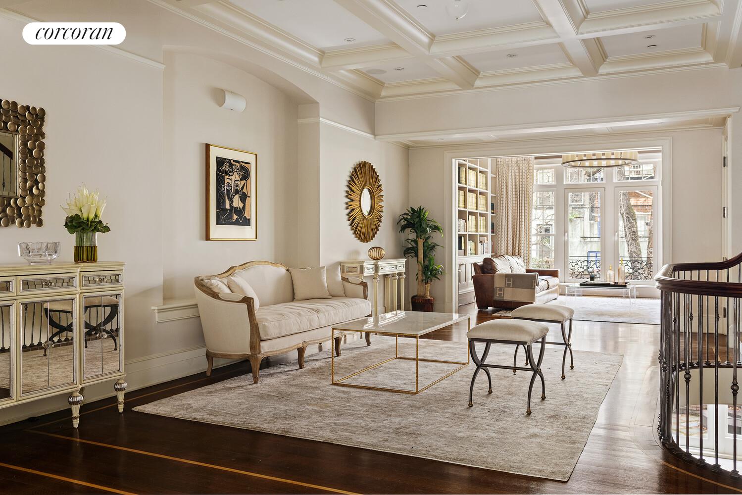 435 East 87th Street Manhattan, NY 10128 - Photo 7 of 36 a living room with furniture a large window and a table