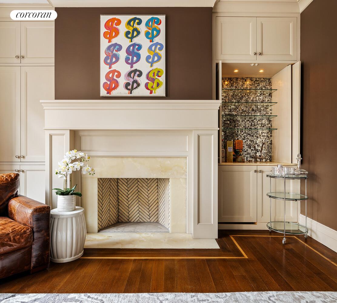 435 East 87th Street Manhattan, NY 10128 - Photo 9 of 36 a living room with furniture and a fireplace