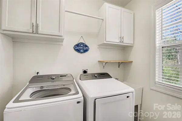 a view of storage and utility room with washer and dryer