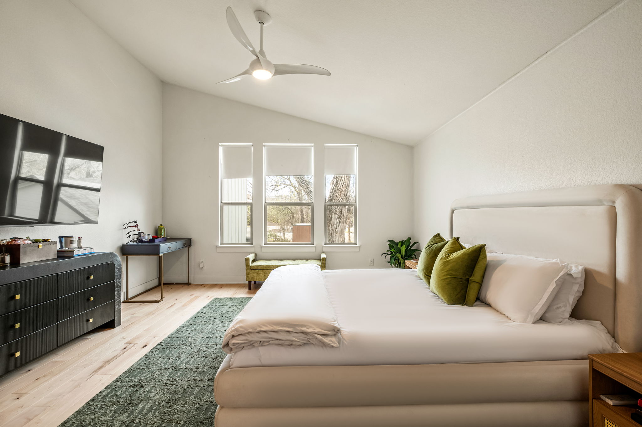 1124 Linden Street, Unit B Austin, TX 78702 - Photo 9 of 26 Bedroom featuring lofted ceiling, light wood-style floors, and ceiling fan