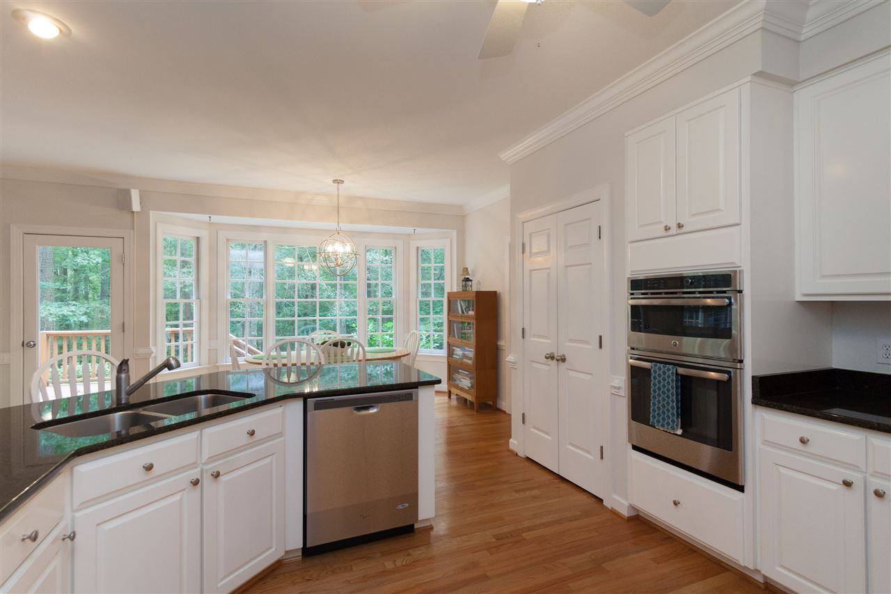 4124 Ridgebrook Bluffs Drive Raleigh, NC 27603 - Photo 6 of 24 Raised breakfast bar, large pantry and ceiling fan. Kitchen