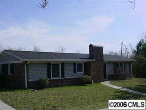 4704 Benfield Road Gastonia, NC 28056 - Photo 2 of 3 a front view of a house with a garden