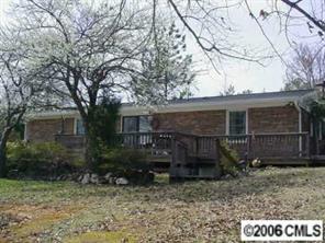 4704 Benfield Road Gastonia, NC 28056 - Photo 3 of 3 a view of a house with a yard and large tree