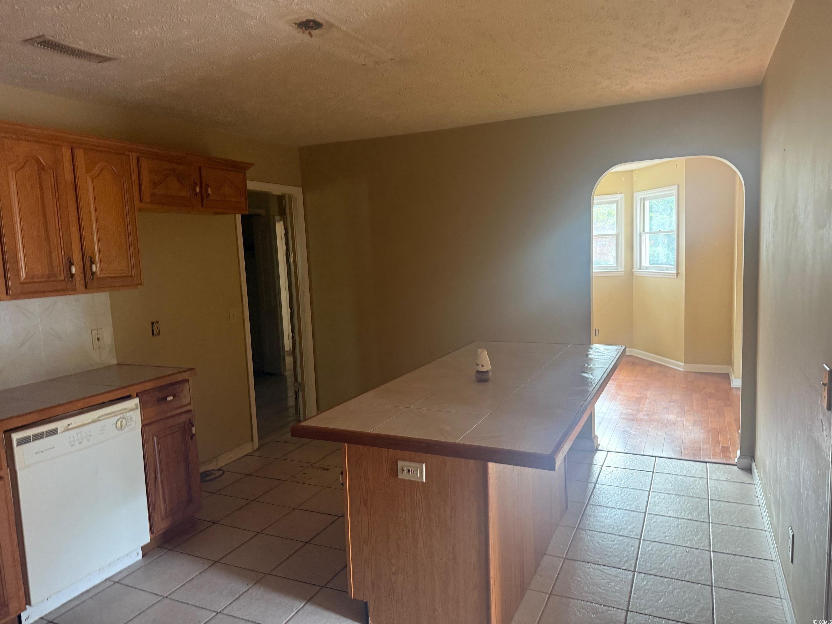 4249 Highway 9 Loris, SC 29569 - Photo 9 of 15 Kitchen featuring light tile patterned floors, arc