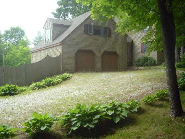700 W Road Richmond, MA 01254 - Photo 3 of 12 a backyard of a house with plants and large tree