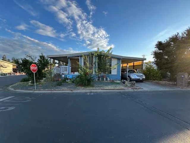 a view of a house with a street